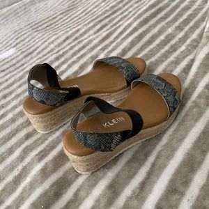 Women’s leopard and black wedges.